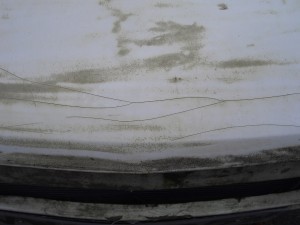 The front of this Mk1 has several nasties: The gel cracks are clearly the result of accident damage.  The grey stains are where the gel pigment has been discoloured by UV light and the exposure has led to micro-cracking.